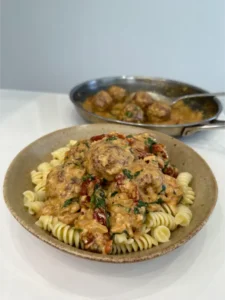 Meatballs in a creamy sun-dried tomato sauce 