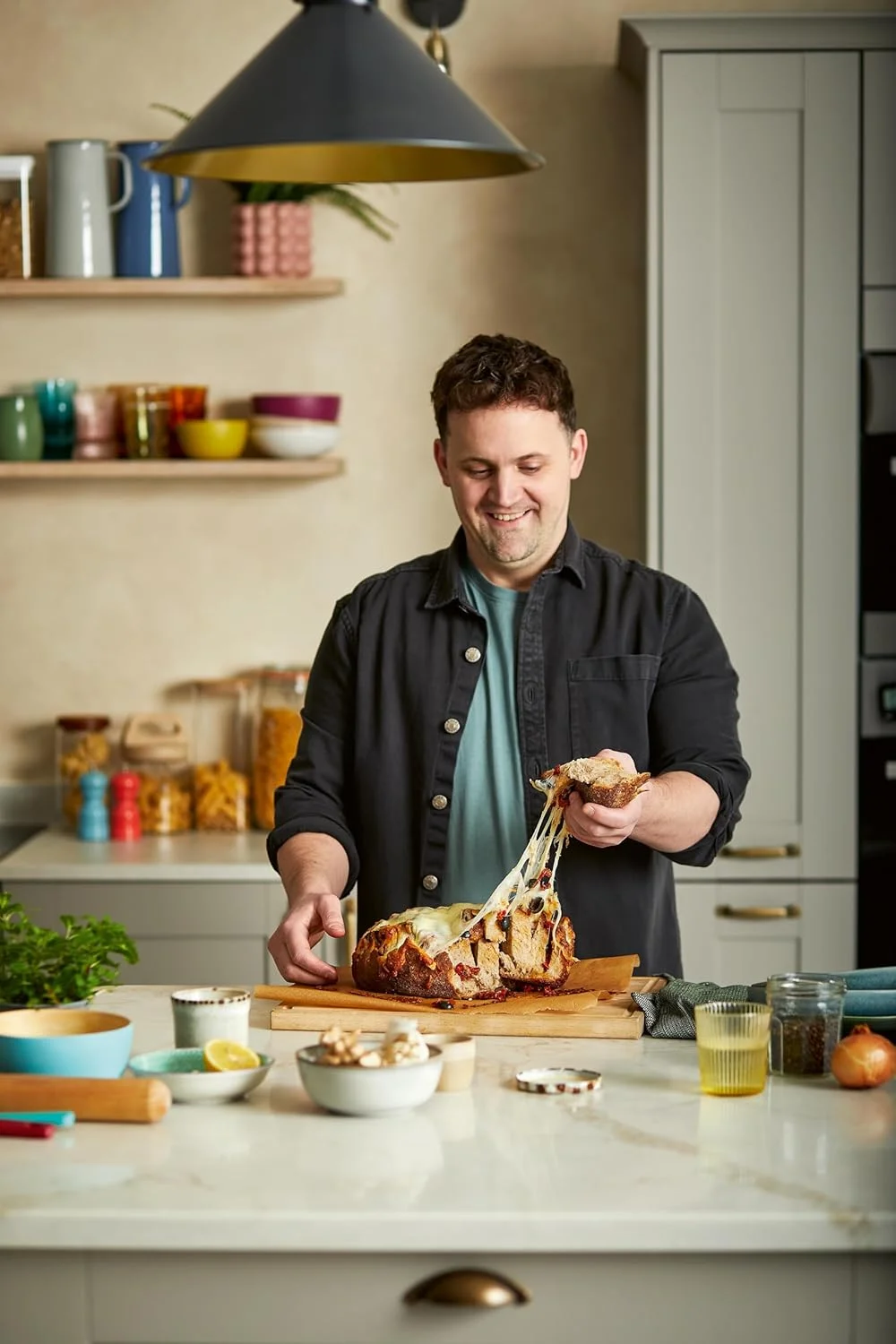 Jon Watts cooking a recipe from Speedy Comfort cookbook