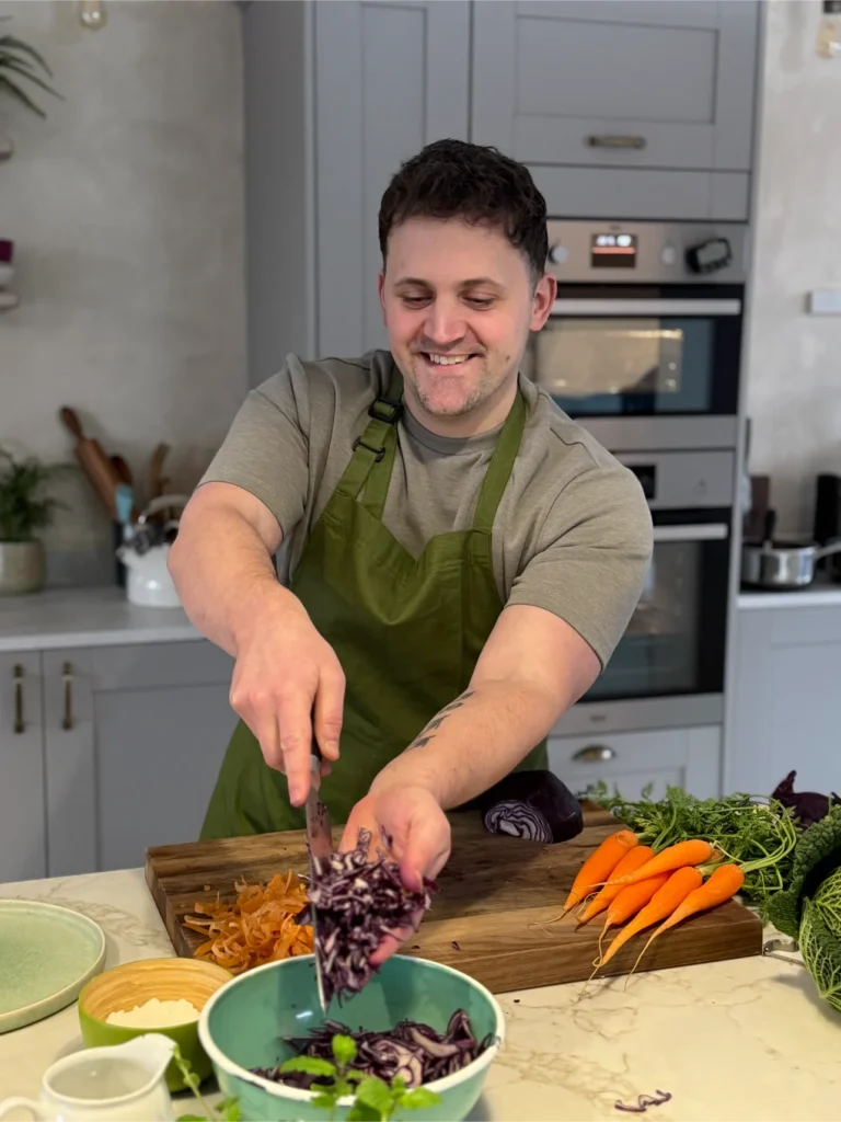 Jon prepping vegetables in the kitchen